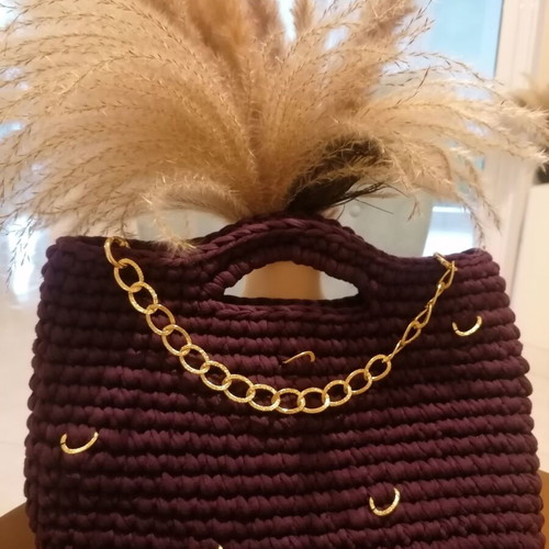 Handmade crochet handbag in eggplant color with gold details