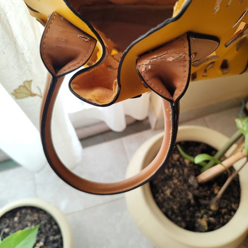 Yellow handbag used with beige details