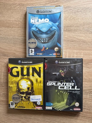 Nintendo GameCube games used, pack with Gun, Finding Nemo, Splinter Cell