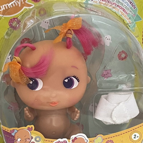 The Bellies Mini Yummy doll used, pink hair, orange bows