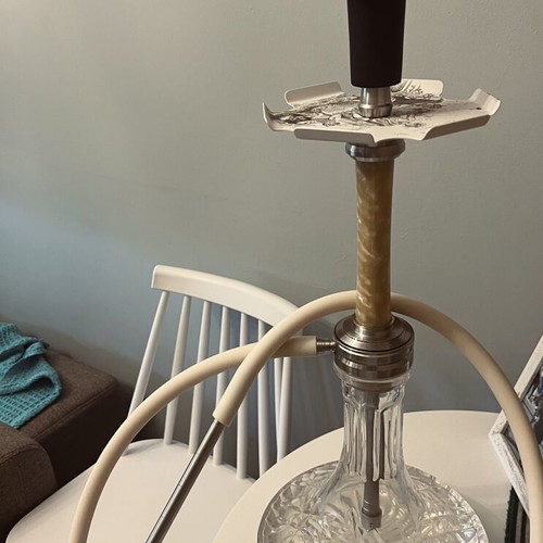 Hookah used with grill, tongs, coals, flavors, and cleaning set