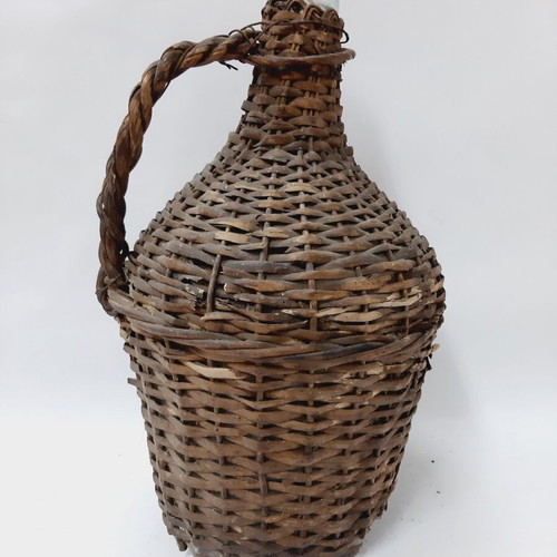 Dame-Jeanne vintage demijohn bottle used, glass with wicker