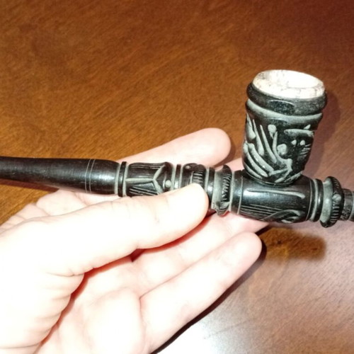 Handmade carved wooden pipe with stone inlay