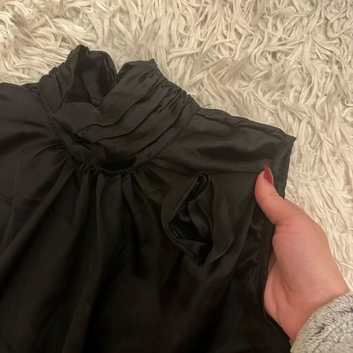 Black satin blouse with 3-D rose design like new