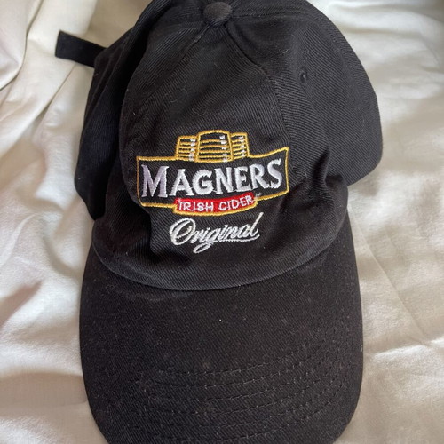 Magners cider branded hat used with small discoloration