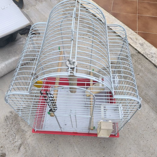 Metal birdcage like new with perches and feeders