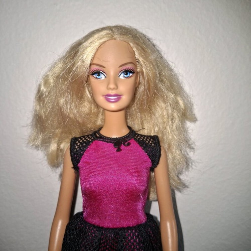 Barbie doll used with original dress and necklace