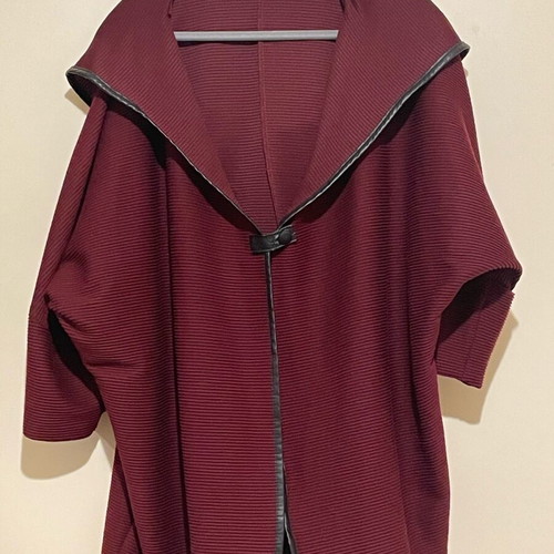 Cape-style coat used with sleeves and hood burgundy