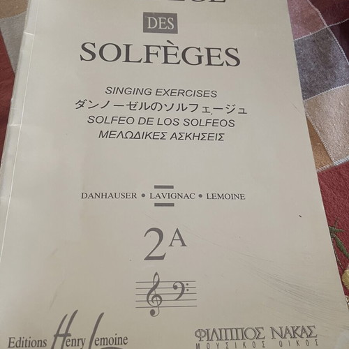 Guitar method and two solfège music books