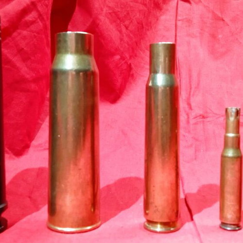 Empty deactivated cartridge cases used, various calibers including M-230 from AH-64 Apache