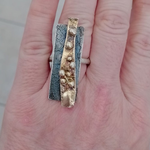 Statement two-tone ring used with layers, silver and gold colors