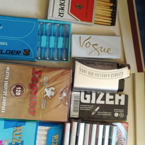 Vintage smoking collection with lighters, filters & rolling papers