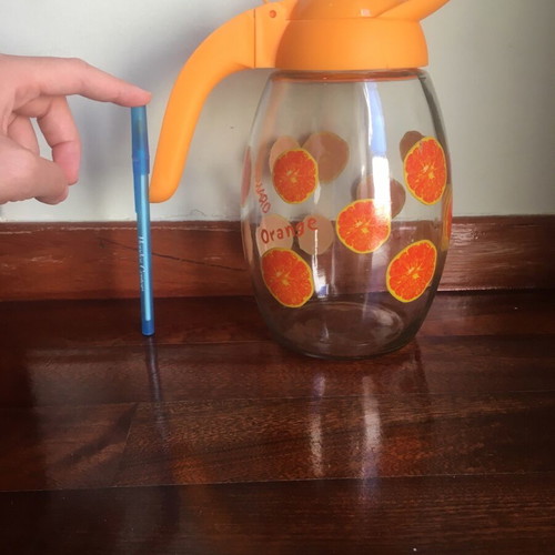 Solmazer jug like new with orange pattern and plastic lid