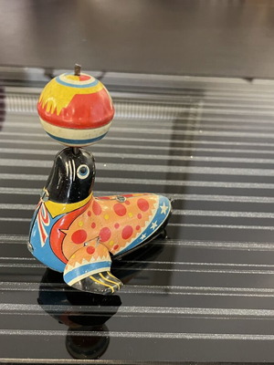 Seal with spinning ball vintage tin toy used