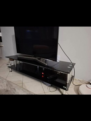 TV stand like new, black with silver details, glass material