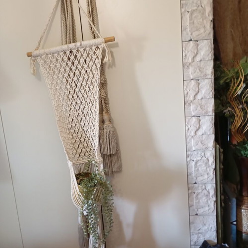 Two knitted wall hangers for pots, different sizes