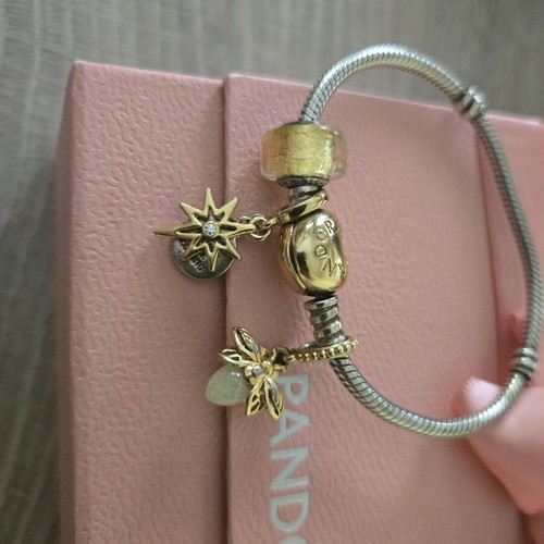 Pandora authentic bracelet like new with 3 gift charms silver and gold