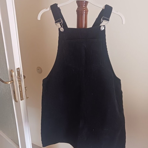 Black corduroy salopette with front and side pockets