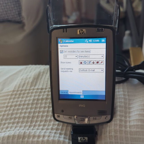 HP iPAQ HX2490b PDA used with charging dock and accessories