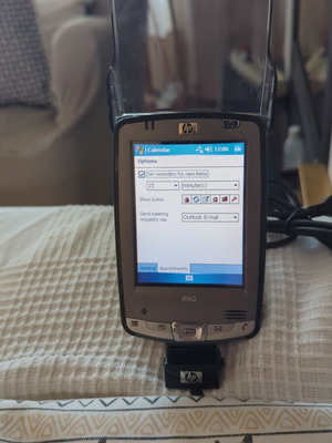 HP iPAQ HX2490b PDA used with charging dock and accessories