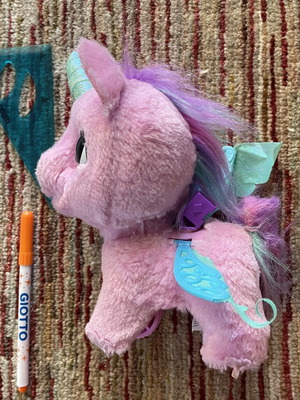 Unicorn doll used with sound and motion wand