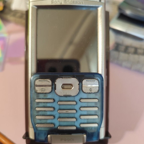 Sony Ericsson P990i vintage cell phone used with charger