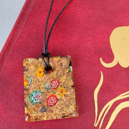 Murano pendant with millefiori floral design and aventurine base