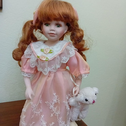 Porcelain doll like new, height 32cm