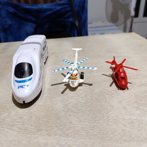 Plastic helicopter and train figures used