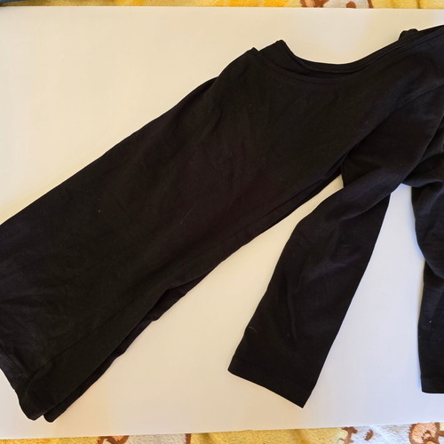 Long-sleeve top used black, open neckline