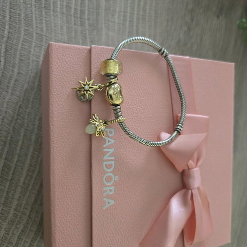 Pandora authentic bracelet like new with 3 gift charms silver and gold