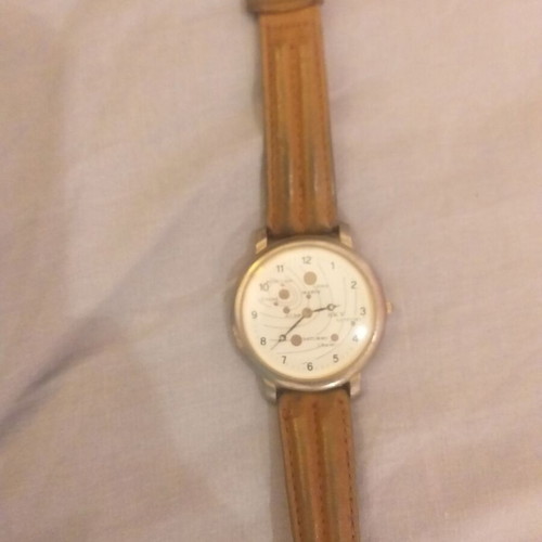 Wristwatch with planet design used, brown leather strap