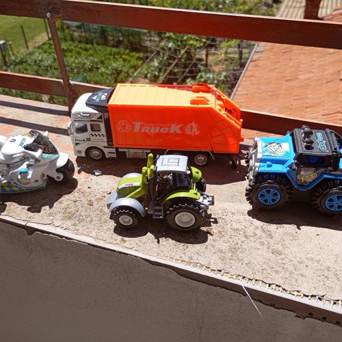 Lot of 4 used medium-sized children's toy vehicles