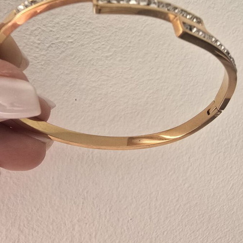 Steel bracelet in rose gold color with decorative stones, like new
