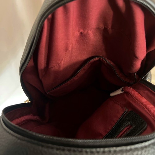 Black backpack used with studs