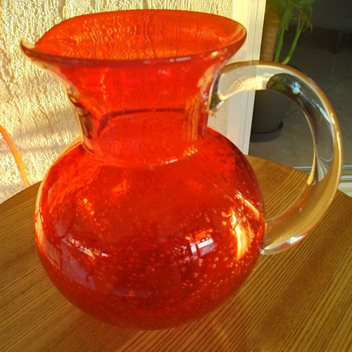 Vintage glass pitcher with handle, orange color, new