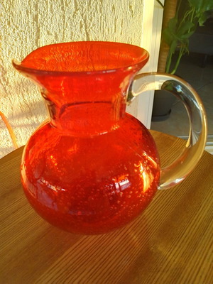 Vintage glass pitcher with handle, orange color, new