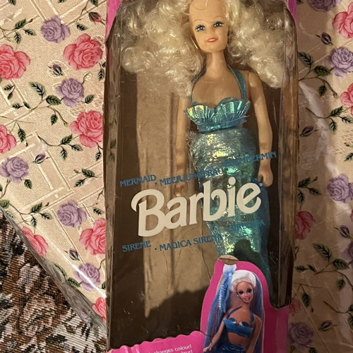Mermaid doll with clothes used, damaged doll and worn clothes