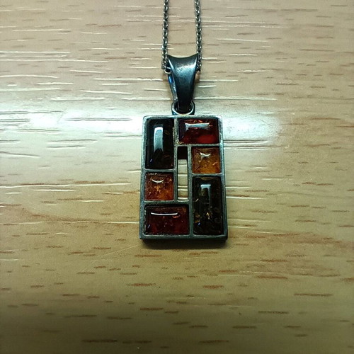 Silver pendant with Baltic amber like new