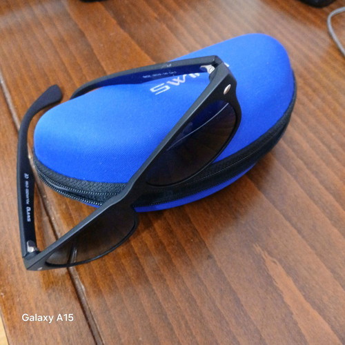 Swing sunglasses new with black plastic frame and men's lenses