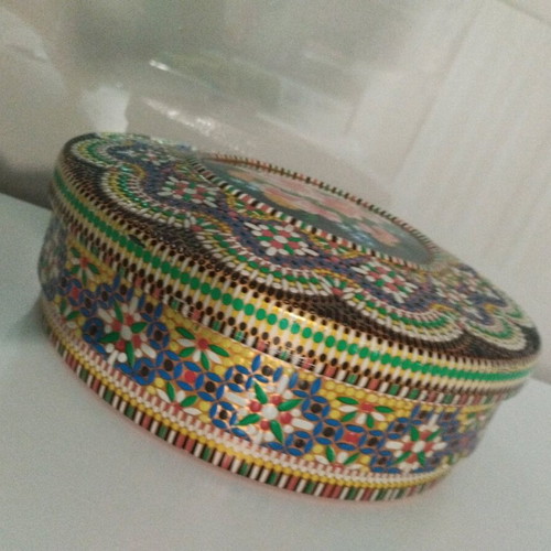 Vintage metal box with embossed floral design and Pointillism mosaic