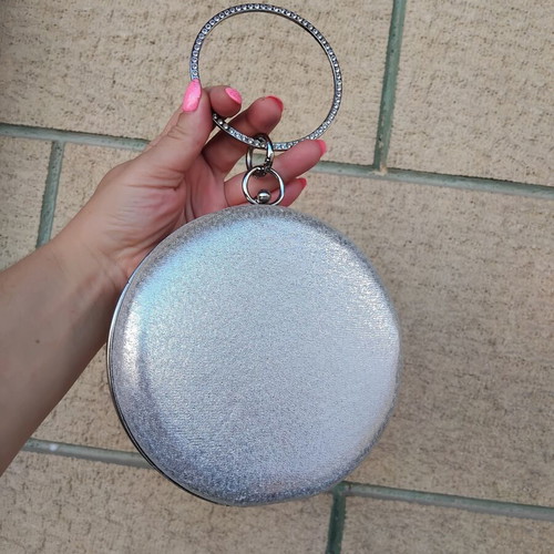 Round silver evening clutch bag with rhinestone ring handle used