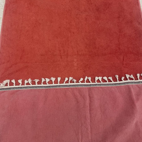 Beach towel used, coral color