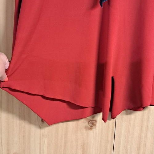 Women's elegant red blouse with black and white ribbon