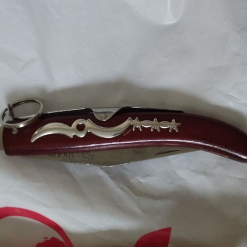 Okapi folding knife with rosary gift, like new