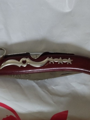 Okapi folding knife with rosary gift, like new