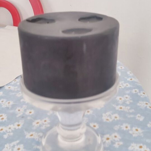 Black candle with transparent glass candlestick used