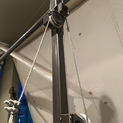 Training rack with barbell and pulley system