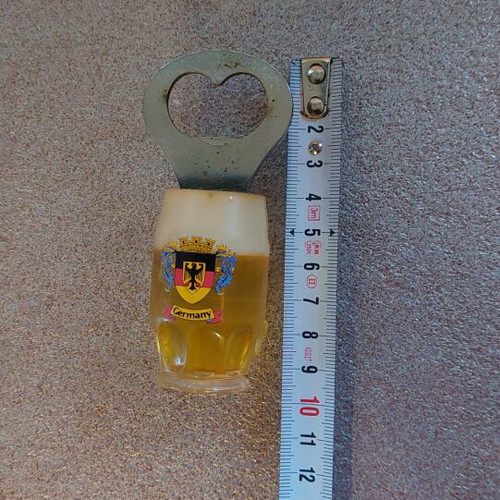 Decorative bottle opener used with wear around the magnet