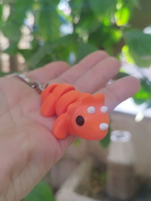 3D printed flexi baby triceratops dinosaur keychain made to order